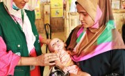 The nutrition counsellor of Concern’s Jamtoli OTP centre Saleha Akter Jhuma is checking the health condition of Uzair (not real name). He came OTP for follow up check-up. When Uzair came to Jamtoli OTP centre, he was severely malnourished and had very low appetite. After taking the nutritious diet for three weeks, Uzair is a healthy baby now. Nutrition counsellor Jhauma and Uzair’s mother Salma (not real name) both looks very happy to see his improved health condition. Photo: Tariq Adnan/ Concern Worldwide