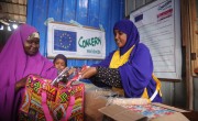 Concern nutrition worker, Naima Islow, dispensing emergency therapeutic food to mother *Hani at an Outpatient Therapeutic Centre . Photo: Mohamed Abdiwahab / Concern Worldwide.