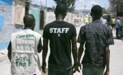 Pascal Louissant, a Project Officer with Concern Haiti, walks through Cité Soleil with members of a local "Foundation". Photo: Kieran McConville/Concern Worldwide.