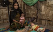 Mahfuja* with 7-month-old twins Rihana* (pink) and Sabiha* (mint green). A Concern Worldwide outreach Nutrition Team discovered that her twin girls were severely malnourished. They were treated at a nearby Concern Nutrition Outpatient Therapeutic Programme centre. Bangladesh. Photo: Abir Abdullah/ Concern Worldwide