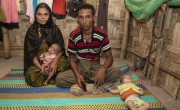 Mahfuja* and Kaseem* with 7-month-old twins Rihana* (pink) and Sabiha* (mint green). A Concern Worldwide outreach Nutrition Team discovered that her twin girls were severely malnourished. They were treated at a nearby Concern Nutrition Outpatient Therapeutic Programme centre. Bangladesh. Photo: Abir Abdullah/ Concern Worldwide