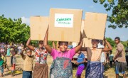 Mother of 2, Belita Andrade brings her Concern Emergency Supplies box home. Malawi. Photo: Gavin Douglas/ Concern Worldwide
