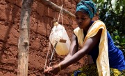 Marie-Chantal shows families how to improve hygiene in the house by using a tip-tap for hand washing. Photo: Darren Vaughan