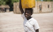 15 year old Liliana Mwenza wa llunga says the new water point and other interventions by the Concern-led WASH consortium in her village, Mulombwa, has had a very positive impact on family life. DRC. Photo: Kieran McConville/ Concern Worldwide