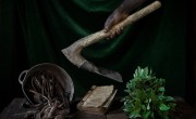 Pictured are Marie's amaranth leaves, pot full of ‘termite’ wood (used as a traditional cure for stomach ache), a book of religious hymns and hoe. Photo: Chris de Bode