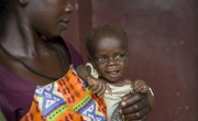 Augustine with her three-month-old son Passi. Photo: Chris de Bode