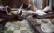 Khadra* and her baby girl Akon* relax in the mother and baby room at the Concern Worldwide Nutrition Clinic in a POC in Juba, South Sudan. Photo: Abbie Trayler-Smith