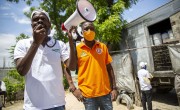 Staff talk to residents during distribution of hygiene kits in Port-au-Prince, Haiti. Photo: Dieu Nalio Chery