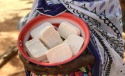 Diaba shows off some of the 600 bars of soap she and other women have made in the past three months. Photo: Darren Vaughan
