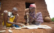 Abinet helps his mother, Workinesh, who set up a business after taking part in a graduation-based programme. Photo: Kieran McConville