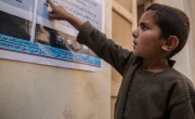 In Northern Afghanistan, Concern is raising awareness of the symptoms and preventative measures people can take in relation to Covid-19. Ghofran* (7) reads the sign. Photo: Stefanie Glinski