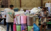 Concern's Warehouse Manager, Mohammed along with Sawsan and Miriam from a local volunteer group, do a stock take of blankets. Photo: Jade van Huisseling