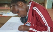 Brighton from Kenya draws what she wants to be when she grows up: a teacher.