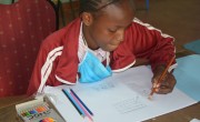 Brighton from Kenya draws what she wants to be when she grows up: a teacher.