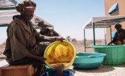 President of the Local Fortified Baby Flour Unit in Niger, Abarchi Madamia gives a tour. Photo: Ollivier Girard