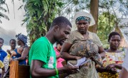 A Concern staff member checks the names of IDPs who have been registered to receive assistance in the Democratic Republic of Congo. Photo: Esdras Tsongo/Concern Worldwide