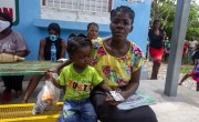 Orlguine Walne, sits with her daughter Abishai , waiting for a distribution of hygienic kits by Concern Worldwide in Cite Soleil slum, a district of Port-au-Prince, Haiti Photo: Dieu Nalio Chery/ Concern Worldwide