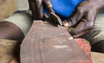 Concern Worldwide has been working with communities in Tonkolili, Sierra Leone to promote and support the manufacture of eco-stoves, made from recycled materials. Pictured is Isse Conteh. Photo: Kieran McConville / Concern Worldwide