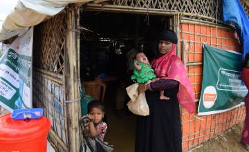 Arshia holds baby Aklima in Cox's Bazar. Photo: Darren Vaughan / Concern Worldwide