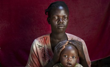 Uba* pictured with her youngest of four children, 8 month old Bilan*. Photo: Abbie Trayler-Smith