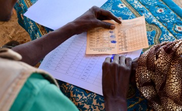300 vulnerable women from Sarkeki receive a money transfer and fortified flour. Photo: Darren Vaughan/Concern Worldwide