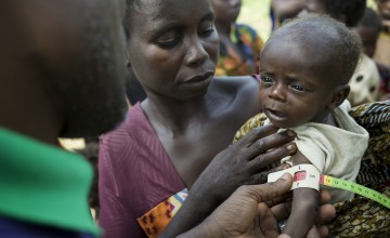 Mum Augustine and her three-month-old son Passi. Photographer: Chris de Bode/Panos for Concern