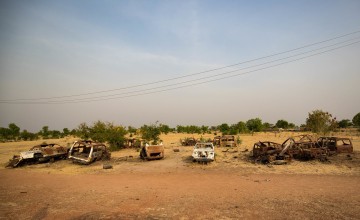 Empty and damaged building and cars are a reminder of the recent conflict in Bentiu Town, South Sudan. Photo: Steve De Neef