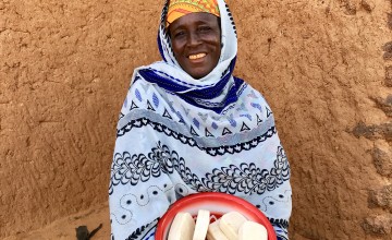 Diaba shows off some of the 600 bars of soap she and other women have made in the past three months. Photo: Darren Vaughan