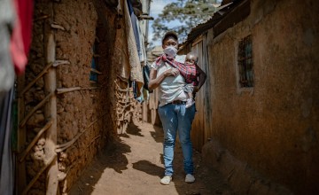 Baby Charlyne and Margret Wanjiru in the alleyway outside there home in Kibera. Nairobi. Photo: Ed Ram