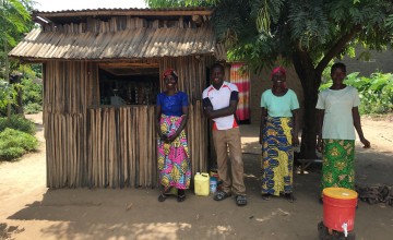 Graduation beneficiaries in front of the shop they have set up under the project; they have taken the initiative to establish a hand-washing station in front of the shop and they report soap sales have increased in the last few days as communities have been sensitised on the importance of hand-washing to prevent COVID transmission. Burundi Photo: Maud Biton / Concern Worldwide