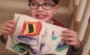 Six-year-old Darragh from Northern Ireland with his drawing of what he wants to be when he grows up.