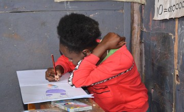 Jane drawing what she wants to be when she grows up: a nurse.