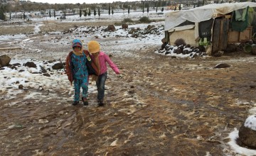 Children playing in the snow at a camp in Lebanon.