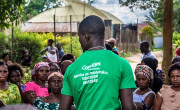 A Concern agent checks the names of IDPs who have been registered to receive assistance in Oicha.  Photo: Esdras Tsongo