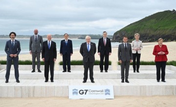 World leaders stand together at the G7