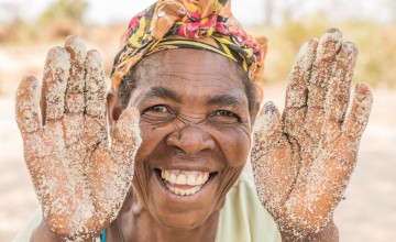 Mother and grandmother Ernestine sells sugar and flour on the road. She began this business with the help of Concern in Manono, Tanganyika. Photo: Pamela Tulizo/ Panos Pictures