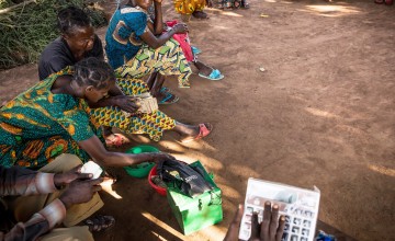 A community savings and loans group in the village of Pension, Manono Territory. Photo: Hugh Kinsella Cunningham