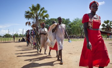 A group of women collect rations from a Concern food distribution in South Sudan, where over a million people have been displaced by conflict.