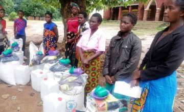 Emergency aid being distributed to communities affected by Cyclone Freddy, Malawi.