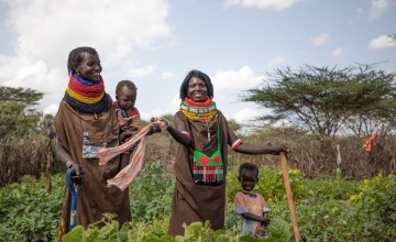 Emuria and her friend Celina in their village kitchen garden. The women have been growing the vegetables for just over a month and have already begun to harvest cowpea leaves. Photo: Gavin Douglas/Concern Worldwide