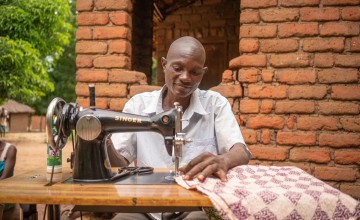 As the Sakha family finished the graduation program, they invested in a sewing machine to start up a tailoring business. Photo: Chris Gagnon/Concern Worldwide