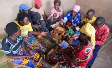 Members of a local savings and loan group in Gisagara, Rwanda, many of whom had to relocate their homes after living in an area at risk of landslides and erosion.