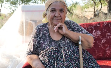 Meryem Kaya sits at the remains of her home in Malatya. Meryem was trapped under the rubble of her home for days following the devastating earthquakes in Türkiye and Syria earlier this year. Photo: Eugene Ikua/Concern Worldwide