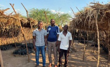 Community members Jalphy, John and Yowasi showcase their nursery