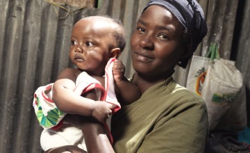 Florence Mutungi (32) with six-month-old Precious - one of her twin daughters. Florence and her husband are bringing up their five children in their one room house in one of Nairobi’s largest slums, Mukuru where chronic malnutrition and stunting is a majo