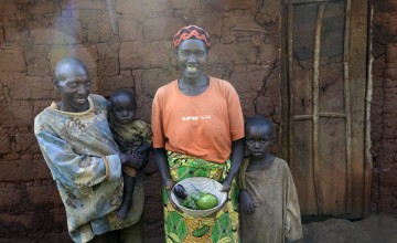 Mother of four Espérence Mutetiwabo and her husband Pascal with their two children