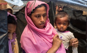 Rama (not her real name) with her 18 month old son, Habiron (not his real name). Habiron has diarrhea and fever. Rama is 8 months pregnant.