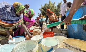 Women collect water delivered by a tanker through UNICEF’s partner, Jebel Marra Charity Organization for Rural Development (JMCO), to the temporary camp for displaced people at Al Rabad School. Water trucking is provided as a temporary measure while damaged boreholes are repaired. Photo: Donaig Le Du/UNICEF
