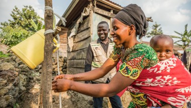 Apoline Niyosenge at a newly installed handwashing station in Kitshanga, DRC. Photo: Pamela Tulizo/Panos/Concern Worldwide