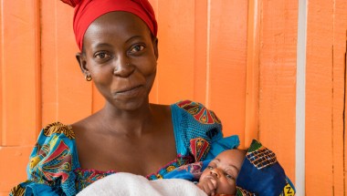 Esperance with her three week old daughter